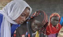 Refugee woman teaches class in South Sudan