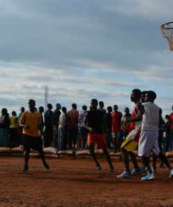 Refugees play basketball in the Dzaleka refugee camp