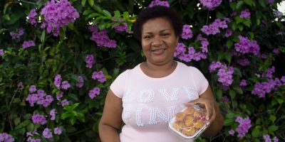 Genifer shows her homemade cocadas.