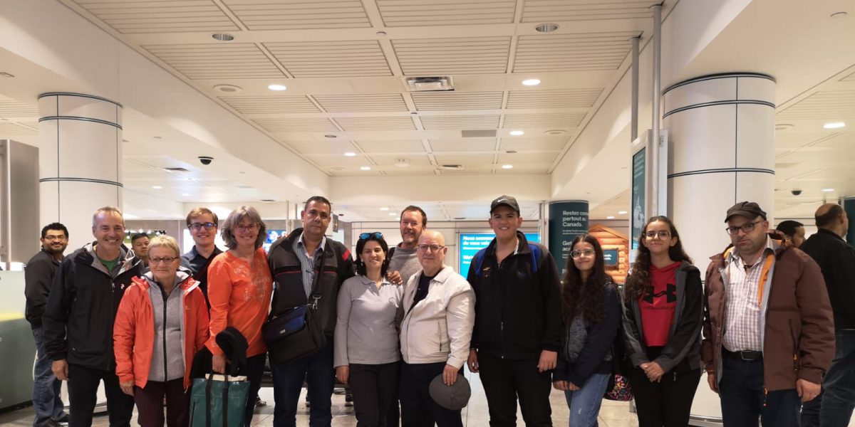 A refugee family from Syria sponsored by JRS Canada at their arrival at the Montreal Airport welcomed by members of the JRS Canada Team.