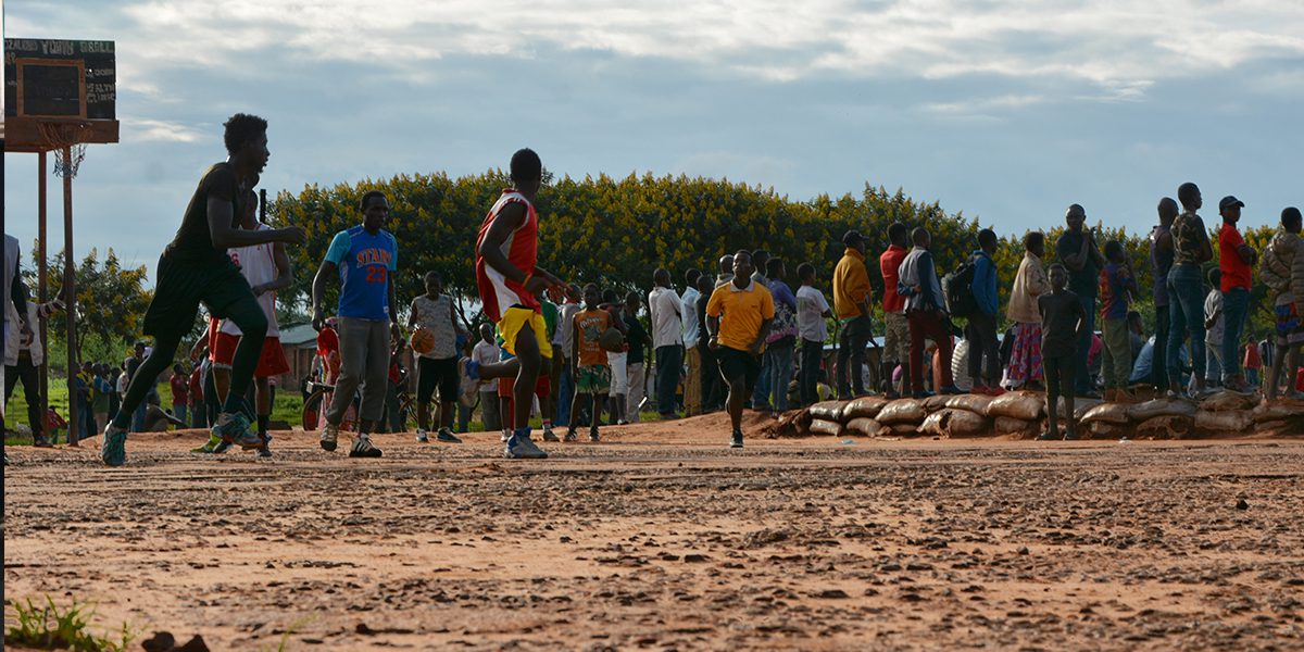Refugees play basketball at the Dzaleka refugee camp.