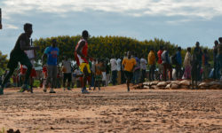 Refugees play basketball at the Dzaleka refugee camp.