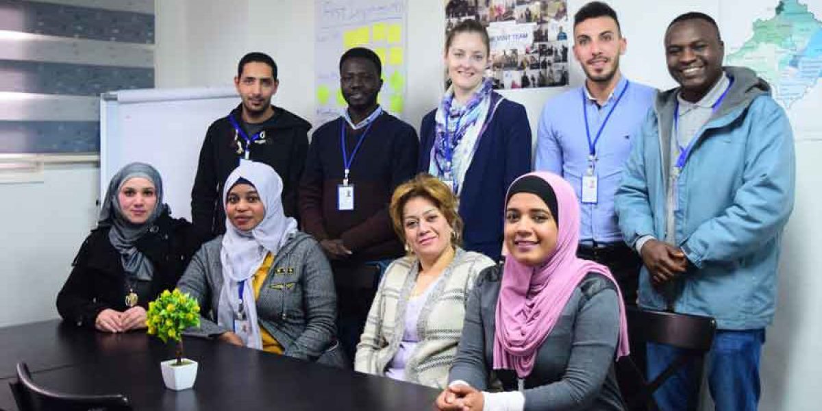 Elizabeth with her team in the JRS office in Amman, Jordan.