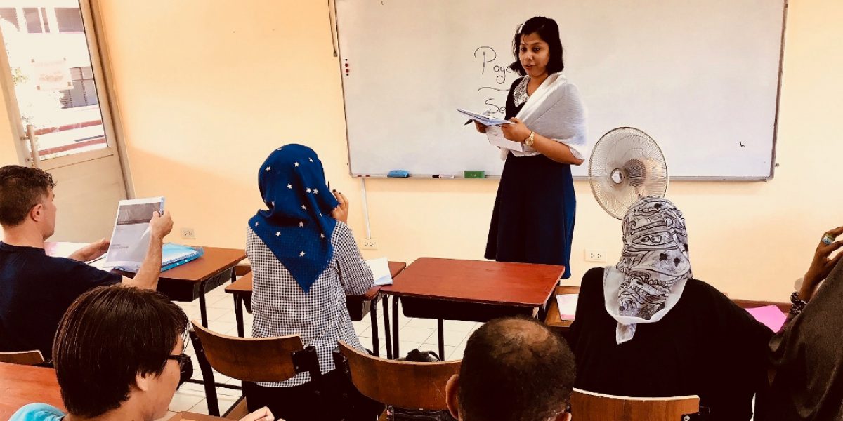 Urban refugees receiving English lessons as part of the Urban Education Project.