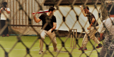 Pakistani refugees playing cricket in Bangkok.