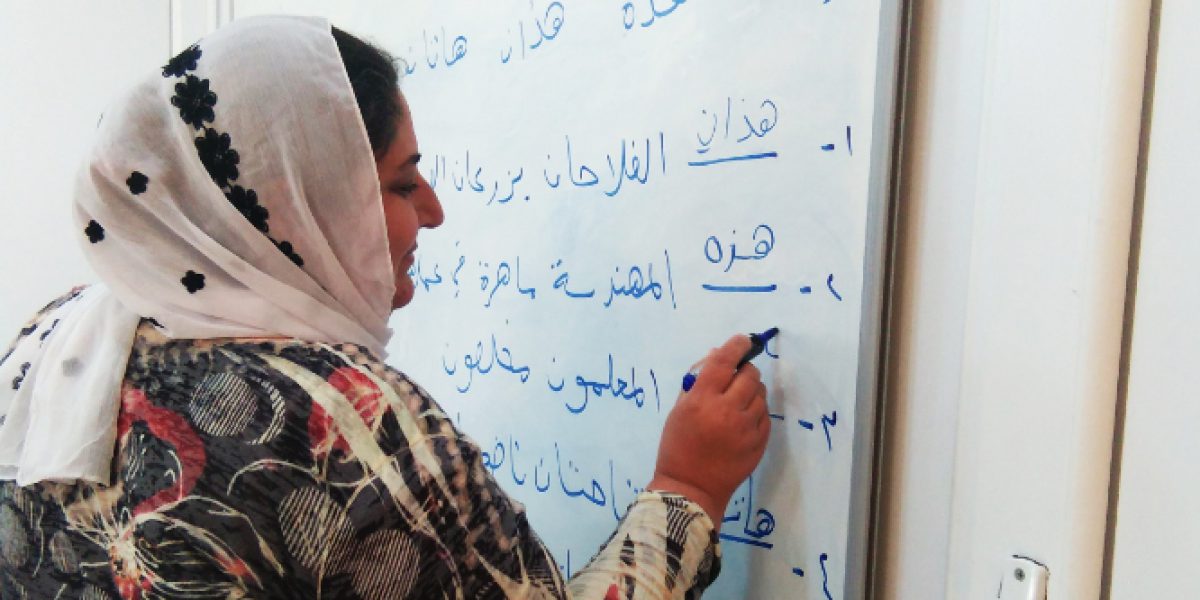 Yazidi woman attending literacy course