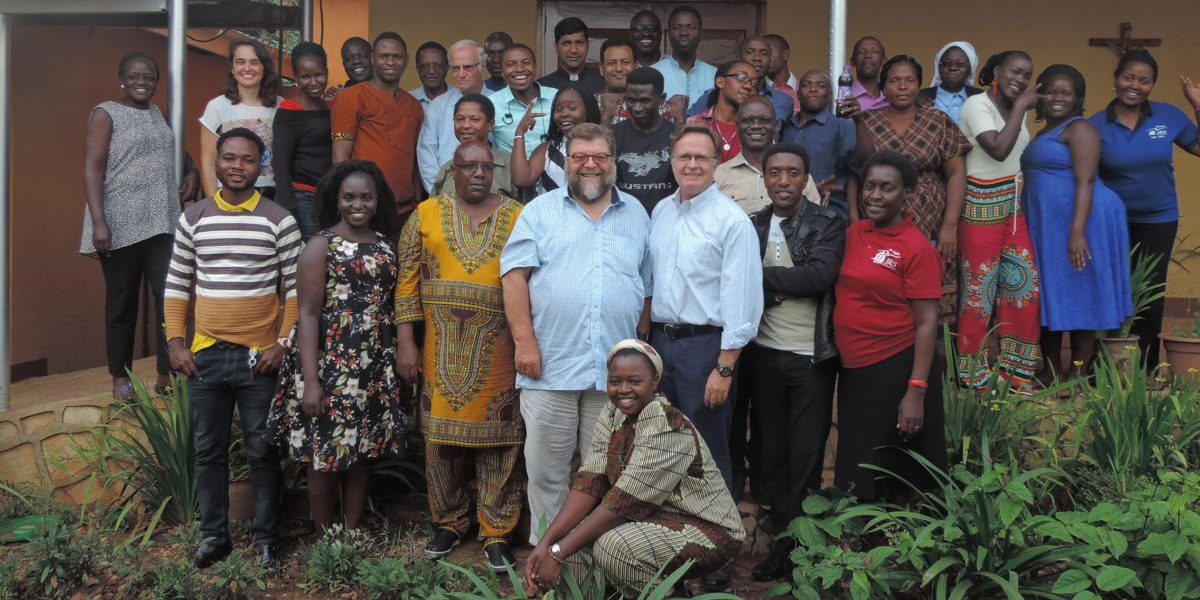 JRS Uganda team with Fr Frido Pflueger SJ and Fr Kevin White SJ.