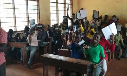 JRS Tanzania: Students showing off their newly received school materials in Kigoma, Tanzania. (Jesuit Refugee Service)
