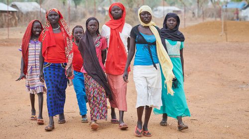 Girls walk to school in the Kaya Refugee Camp in Maban County, South Sudan.