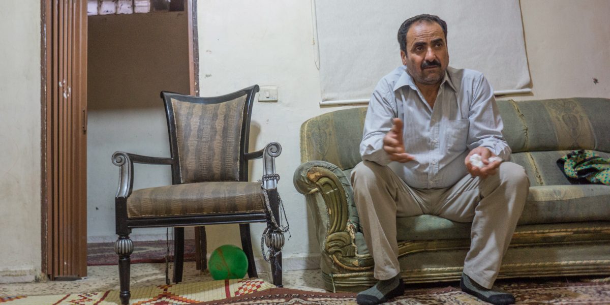 A man shares his story from his apartment in Beirut. (Fr Don Doll SJ / Jesuit Refugee Service)