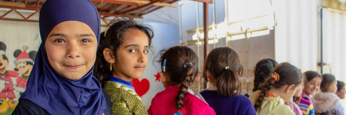 Young female students line up at a JRS school in Baalbek, Lebanon.