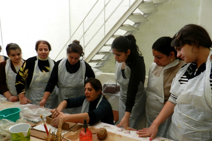 Claude runs pottery workshop for women in the rural area outside Damascus to encourage them to believe in their abilities and regain hope.