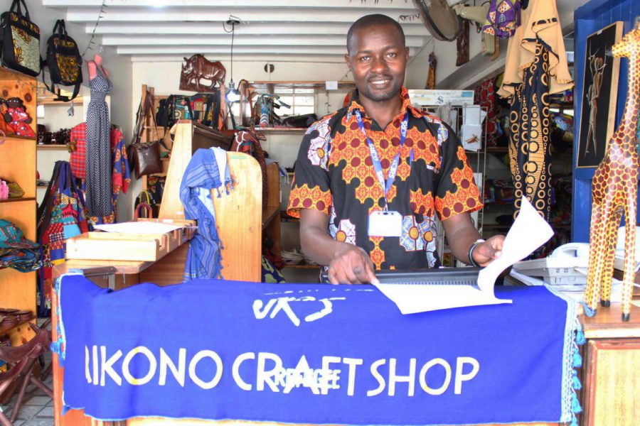 Teddy Salimo runs the JRS Mikono shop, which sells refugee-made handicrafts.