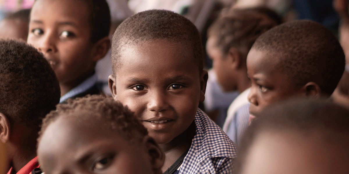 Cover of JRS's 2019 annual report: special needs students participate in an event in Kakuma refugee camp, Kenya.