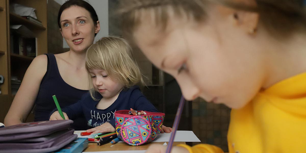 A family hosted in JRS safe space for women and children in Lviv, Ukraine. (Photo: Sergi Camara)