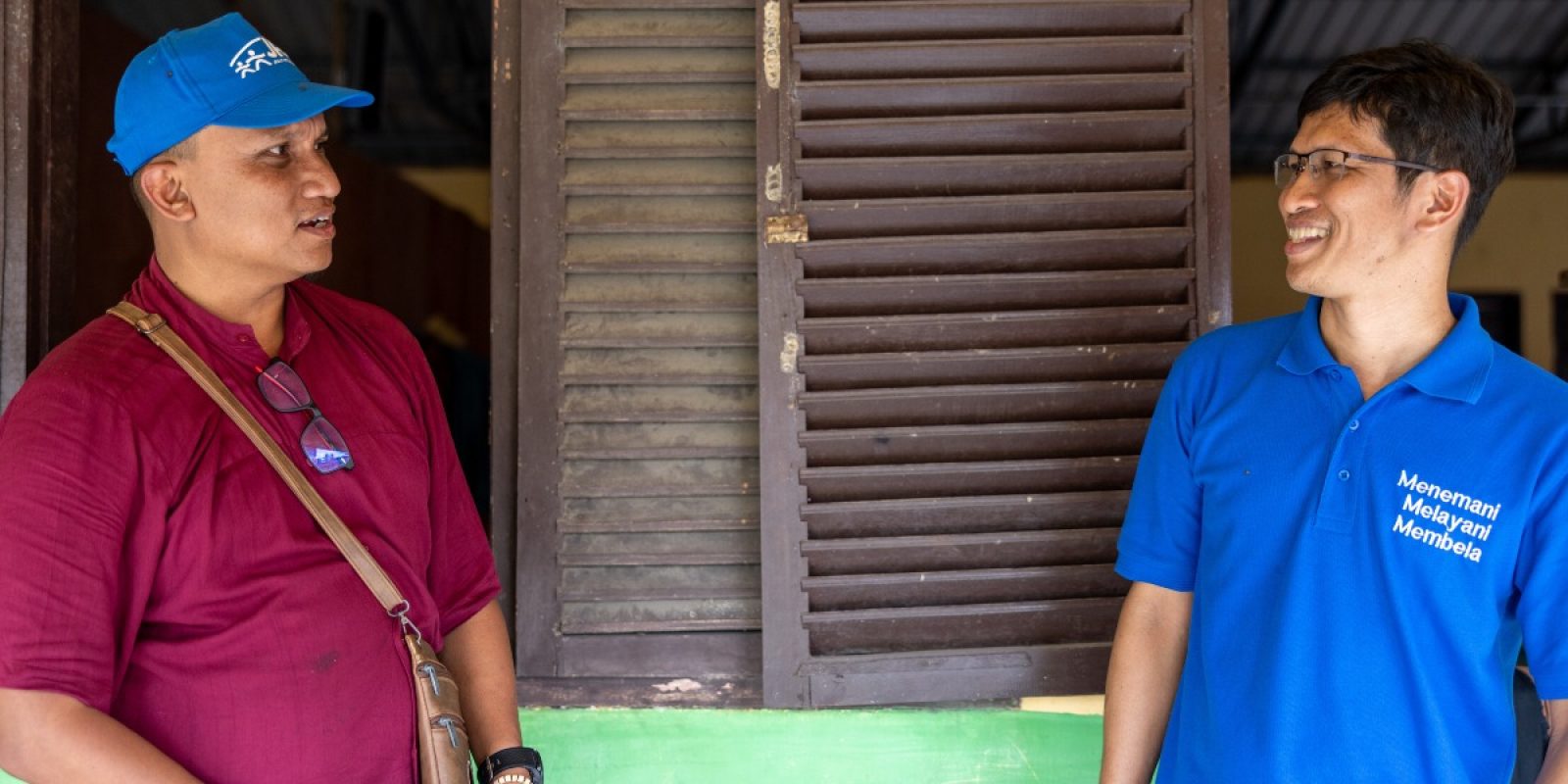 Fr Dam Febrianto SJ, JRS Indonesia Country Director, offers accompaniment as a way of serving refugees in Indonesia. Fr Dam SJ on the right, visiting the Pidie camp, Aceh, Indonesia (Jesuit Refugee Service).