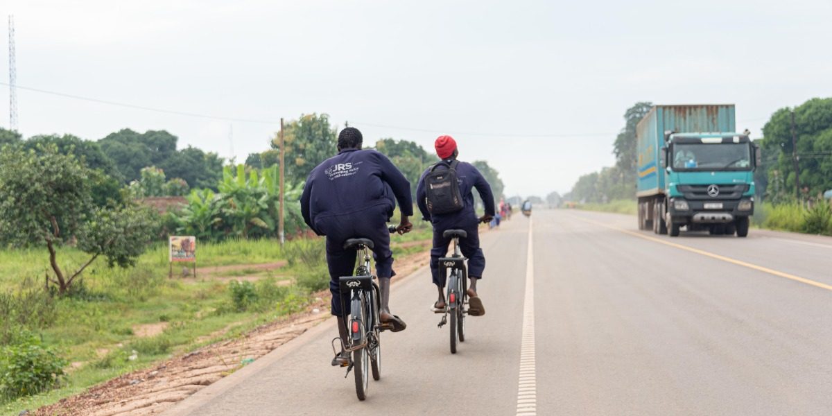 In Uganda, JRS runs an initiative aimed at providing bicycles for students paving the way to quality education. Students riding bicycles to school, in Uganda (Jesuit Refugee Service).