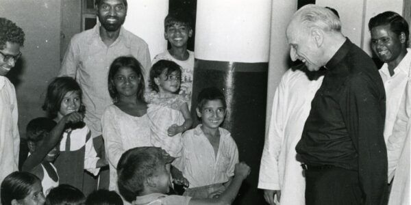 Fr Pedro Arrupe SJ visiting children at a boarding school in India (Society of Jesus). On JRS Day 2024, we commemorate Fr Pedro Arrupe’s spirit and the mission of justice, reconciliation, and shared humanity that he inspired.