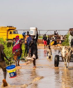Displaced communities saving their belongings after floods in Renk, South Sudan.