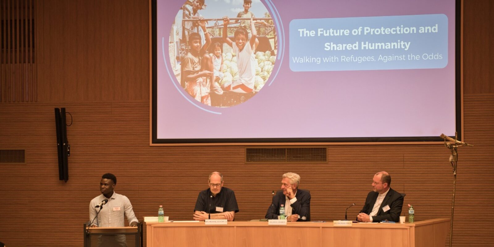 Speakers at the event “The Future of Protection and Our Shared Humanity”. From left to right: Mahamat Daoud, refugee rights advocate, Br Michael Schöpf, JRS International Director, Filippo Grandi, former United Nations High Commissioner for Refugees, and Dr Andreas Frick, General Director of Misereor (Vivian Richard/Jesuit Refugee Service).